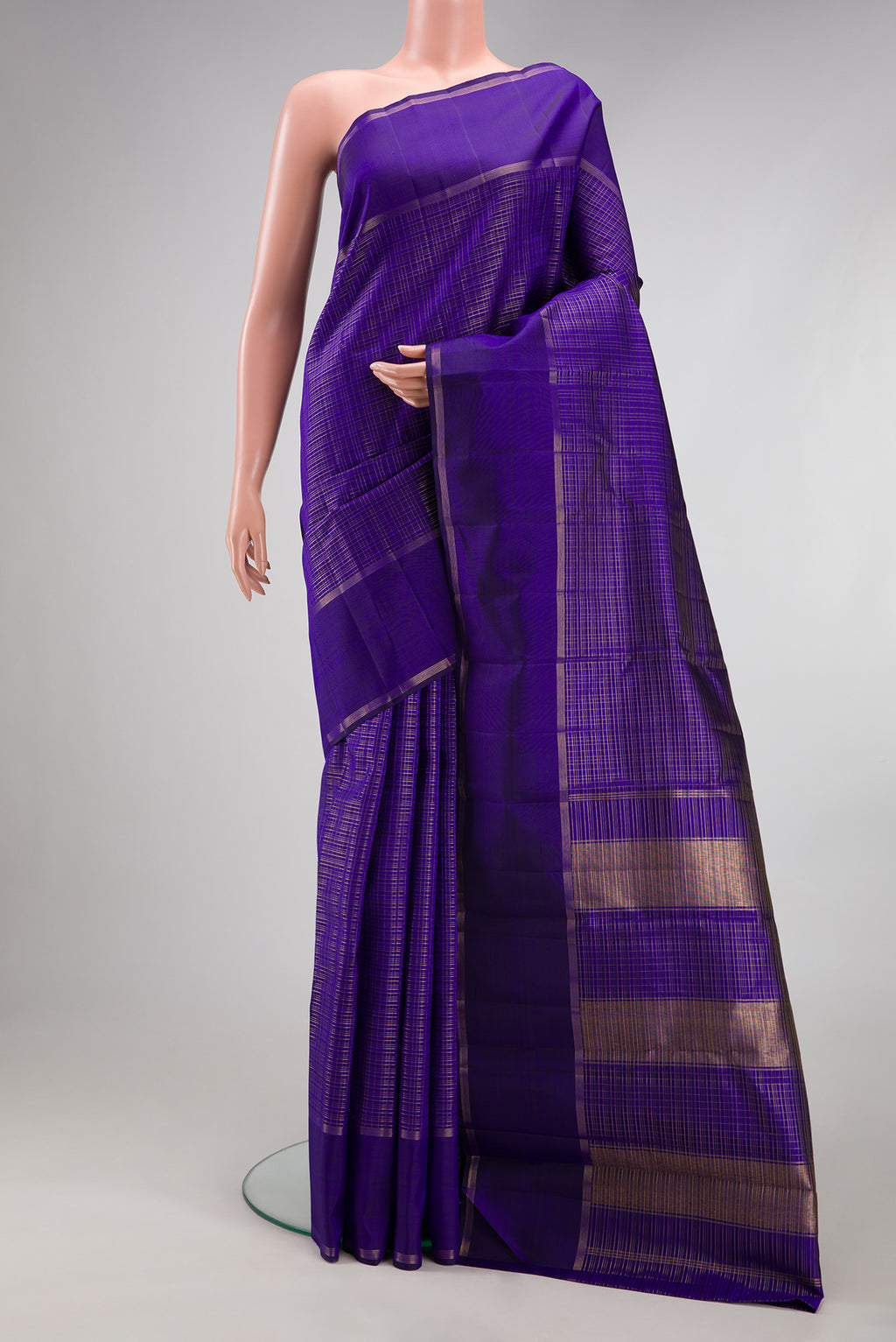 Royal Blue Kanchipuram Silk Saree with Checked design on the body and Zari Border.  displayed on a mannequin