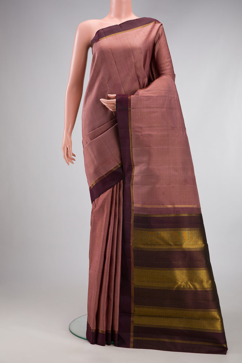 Mauve Kanjivaram Silk Saree with Checked design on the body and Plain Border.  displayed on a mannequin
