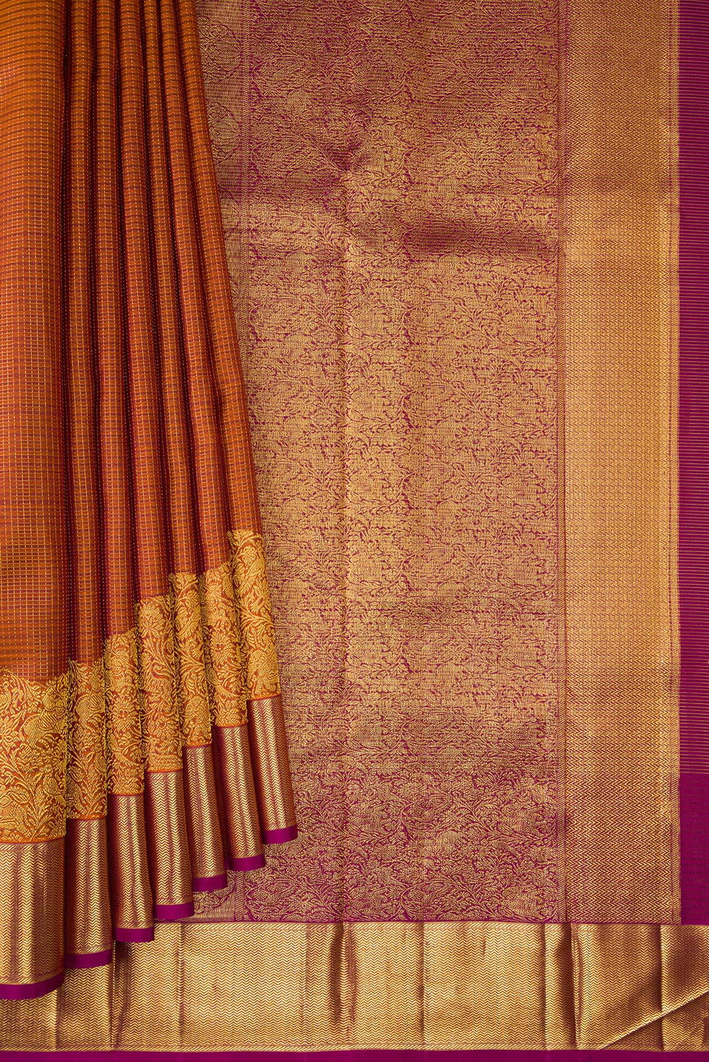Pleats and pallu of Rust Kanchipuram Silk Saree with Checked design on the body and Fancy Border. 