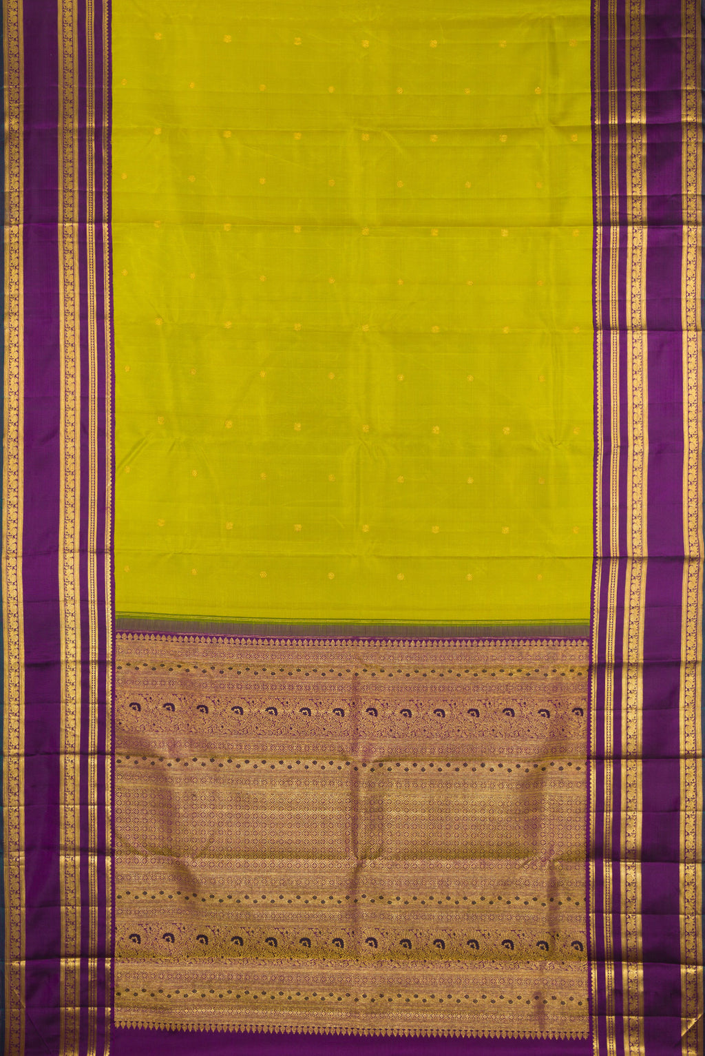 Flat view of Green Kanchipuram Silk Saree with Zari Butta on the body and Zari Border. 