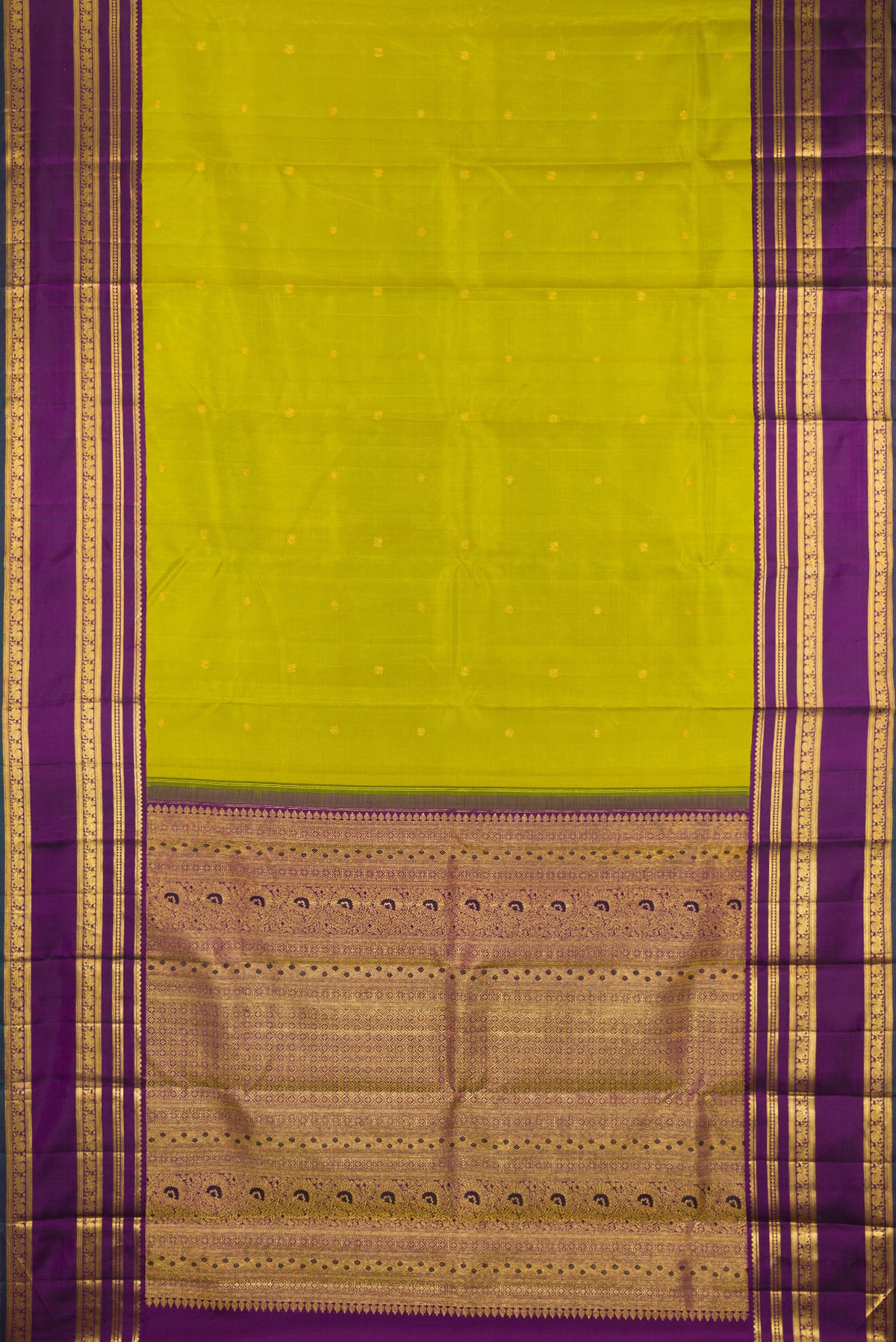 Flat view of Green Kanchipuram Silk Saree with Zari Butta on the body and Zari Border. 