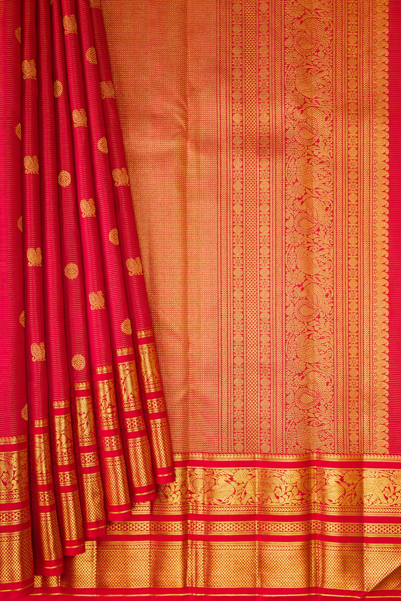 Pleats and pallu of Red Kanchipuram Silk Saree with Stripes on the body and Zari Border. 