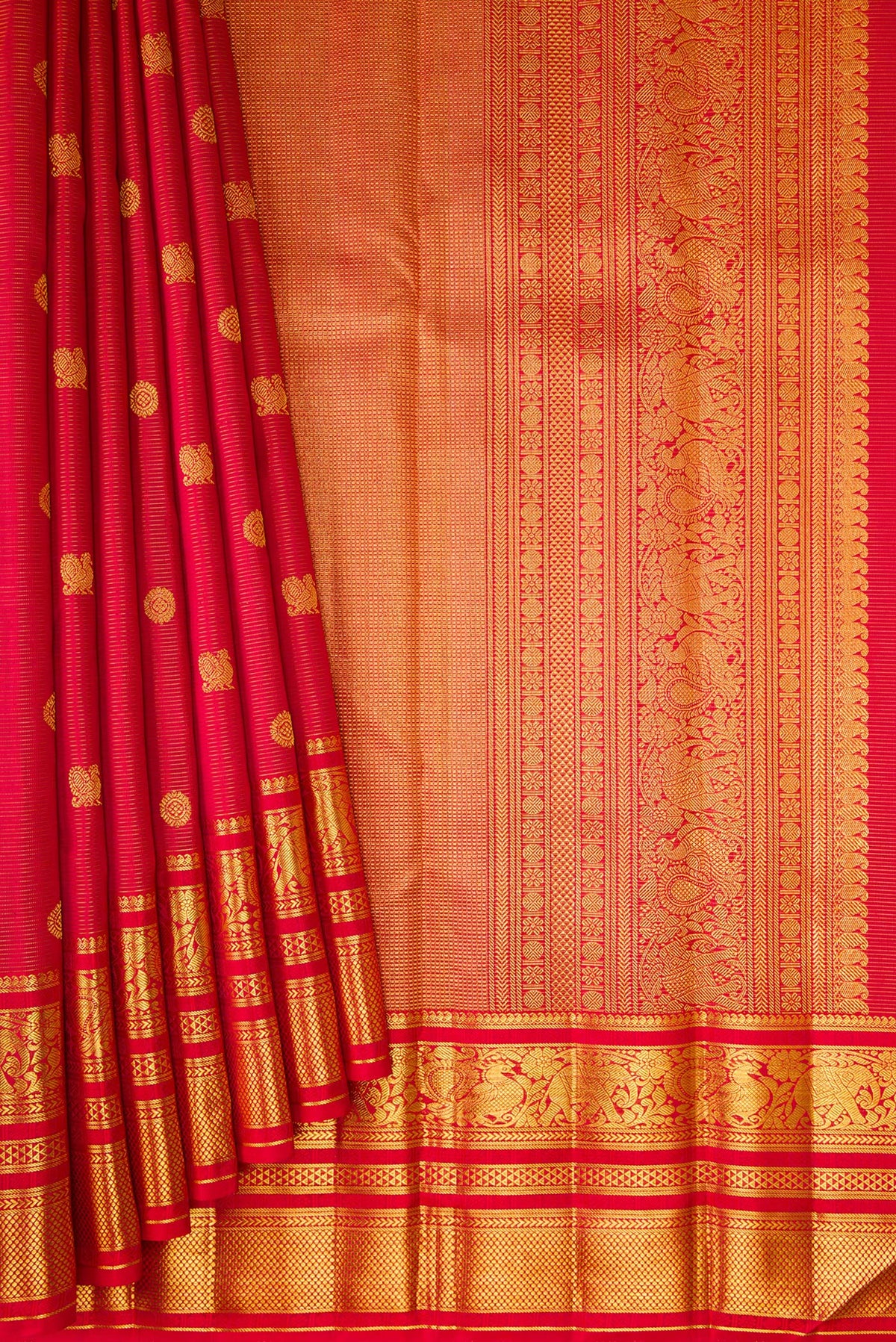 Pleats and pallu of Red Kanchipuram Silk Saree with Stripes on the body and Zari Border. 