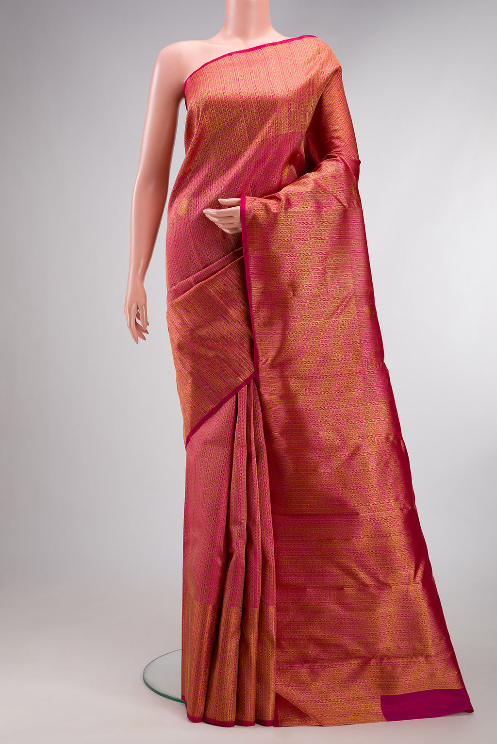 Pure Silk Dark Pink Kanchipuram Saree with Zari Brocade on the body and Zari Border.  displayed on a mannequin