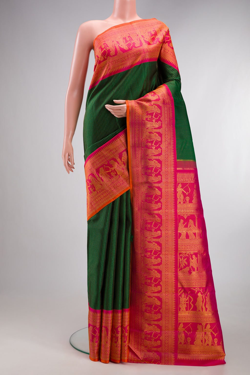 Bottle Green Kanchipuram Silk Saree with Stripes on the body and Fancy Border.  displayed on a mannequin