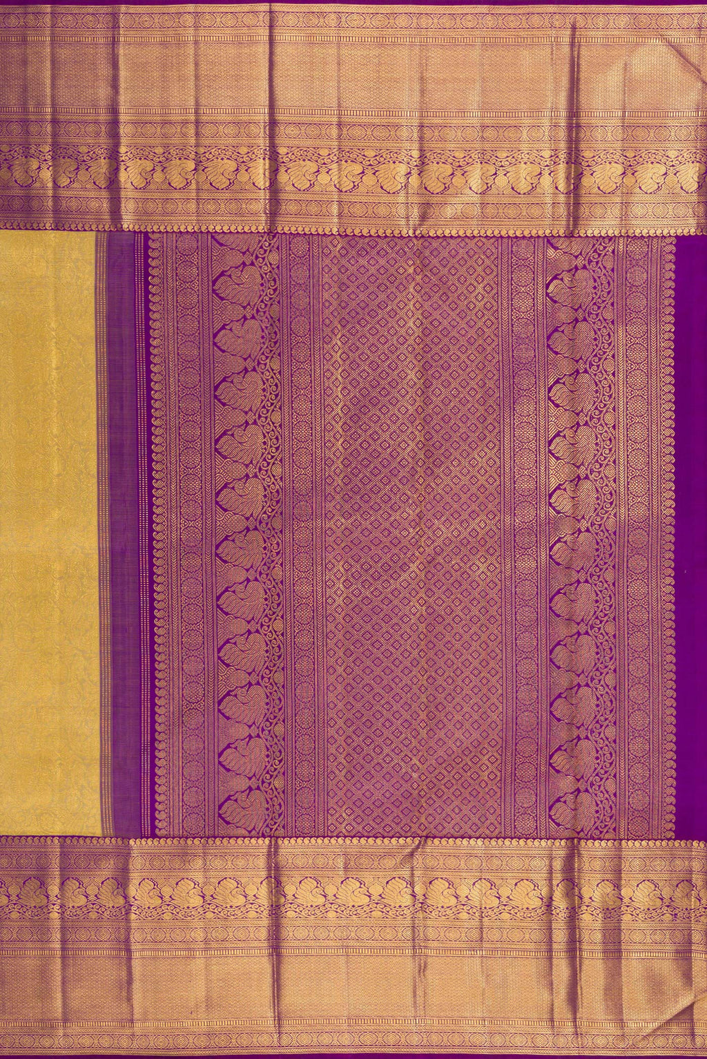 Close up image of the pallu of Gold Kanchipuram Silk Saree with Zari Brocade on the body and Zari Border. 