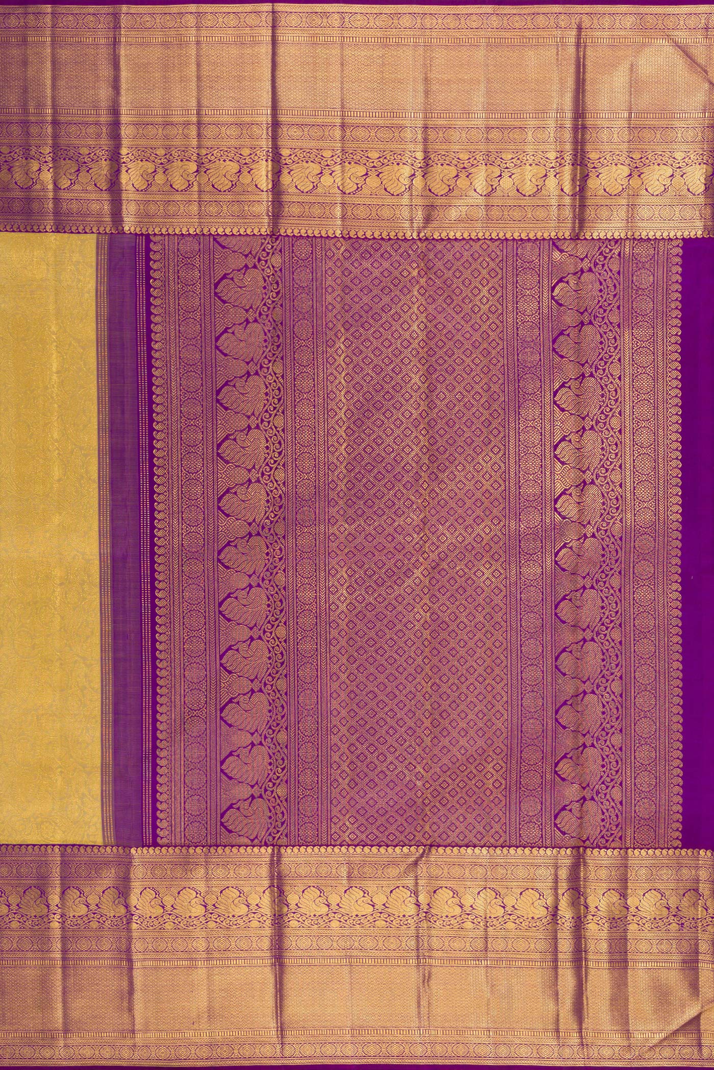 Close up image of the pallu of Gold Kanchipuram Silk Saree with Zari Brocade on the body and Zari Border. 