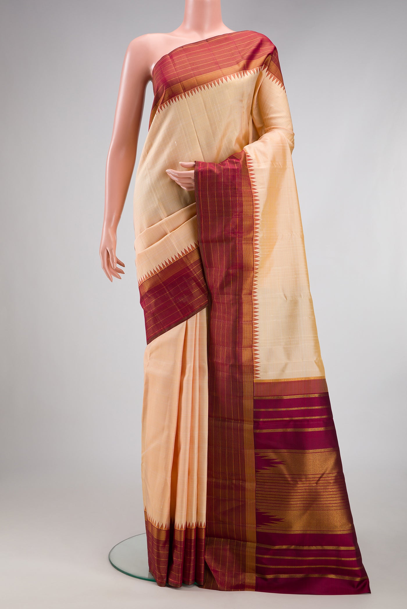 Sandal Kanjivaram Silk Saree with Checked design on the body and Fancy Border.  displayed on a mannequin
