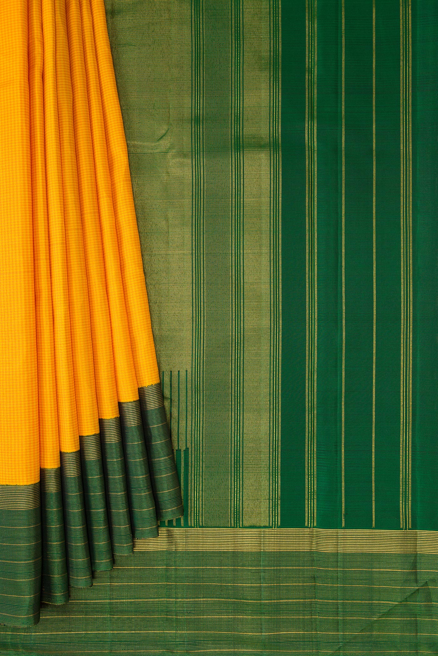 Pleats and pallu of Yellow Kanjivaram Silk Saree with Checked design on the body and Zari Border. 