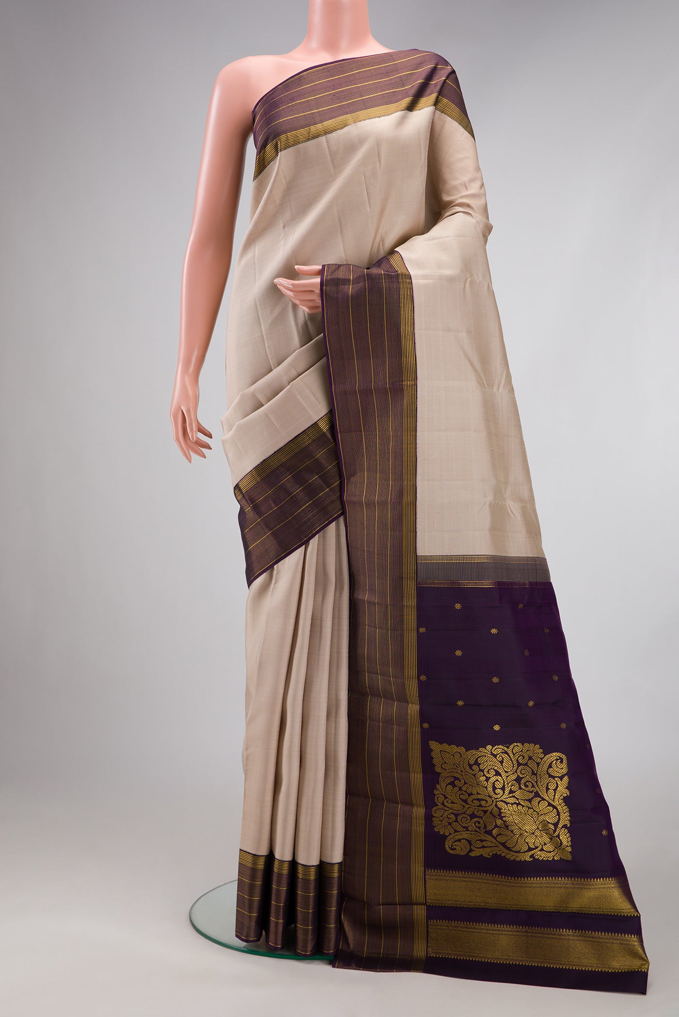 Dark Beige Kanjivaram Silk Saree with Stripes on the body and Zari Border.  displayed on a mannequin