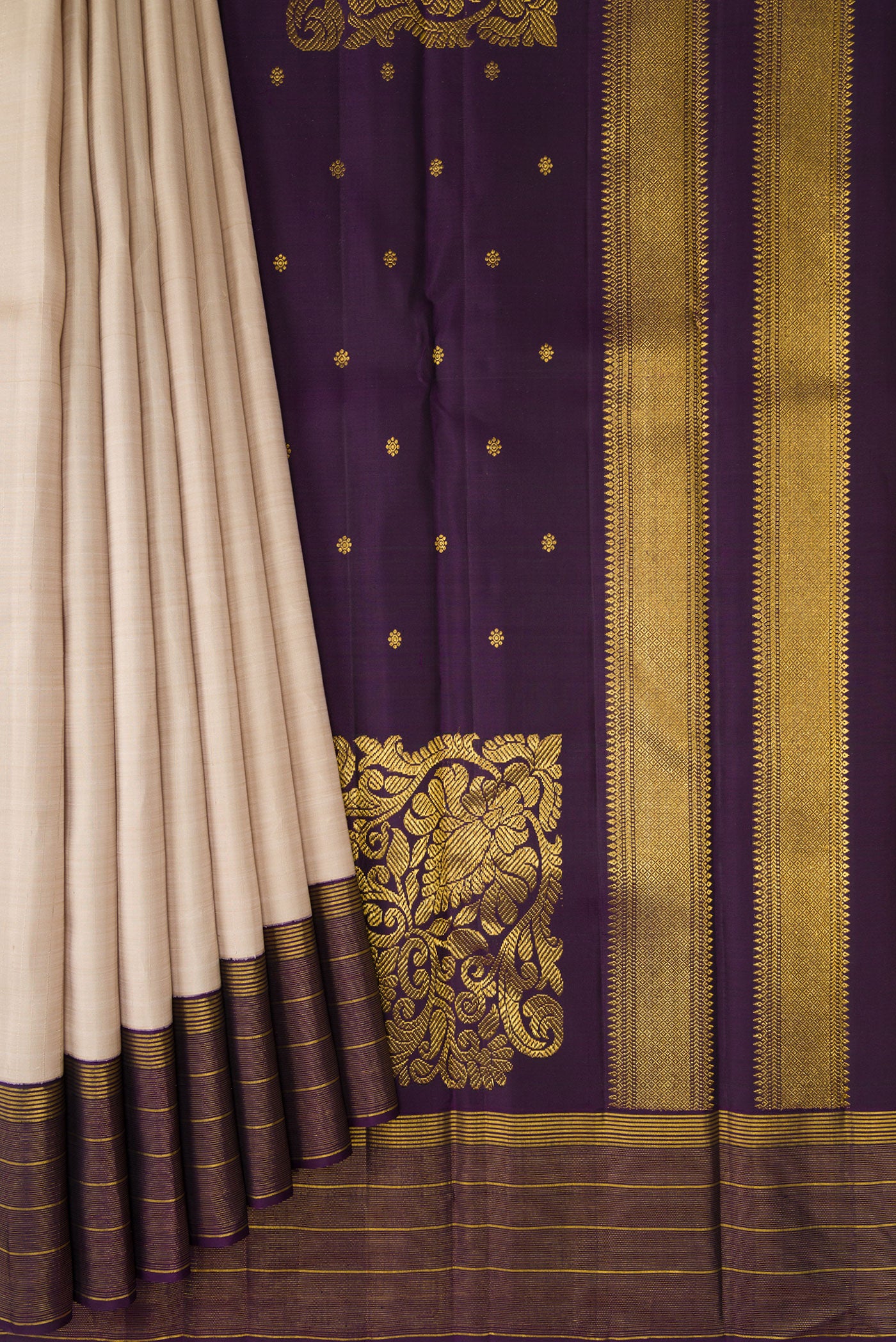 Pleats and pallu of Dark Beige Kanjivaram Silk Saree with Stripes on the body and Zari Border. 