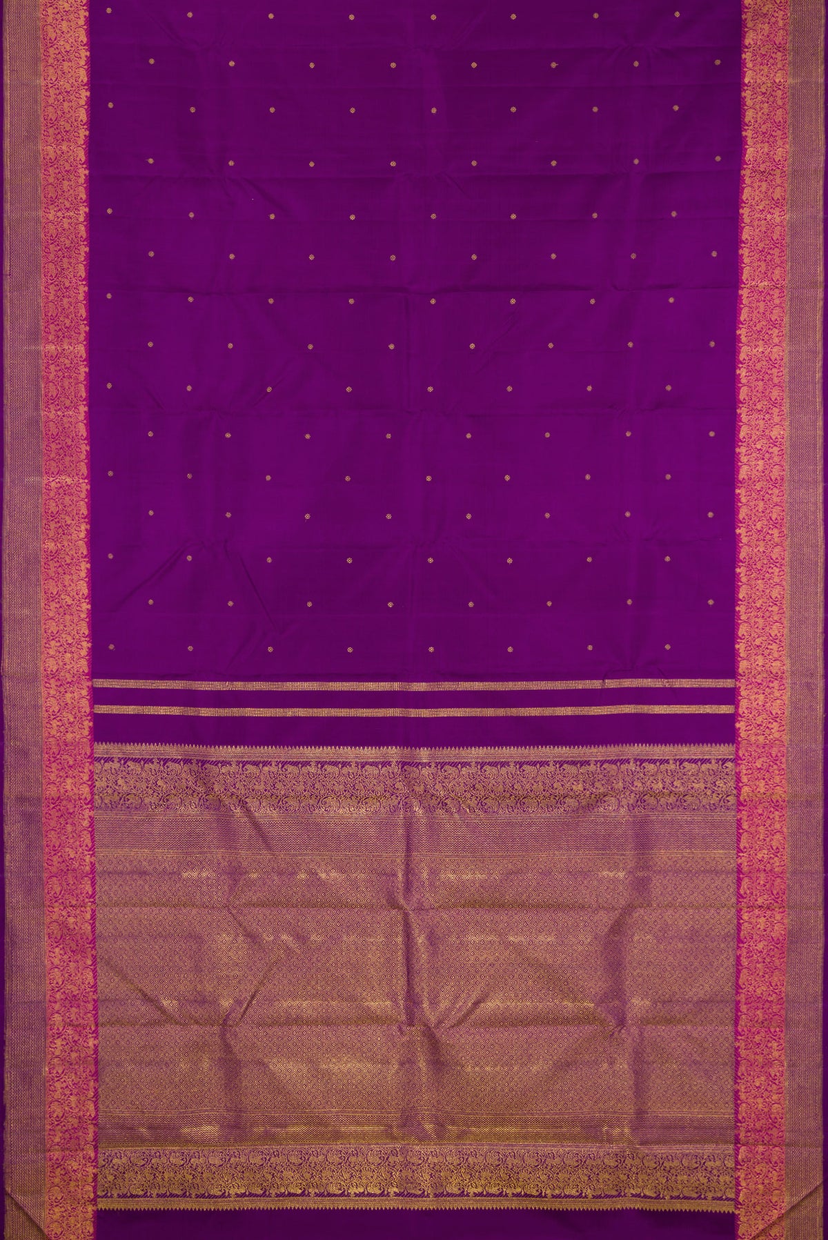 Flat view of Purple Kanjivaram Silk Saree with Zari Butta on the body and Fancy Border. 