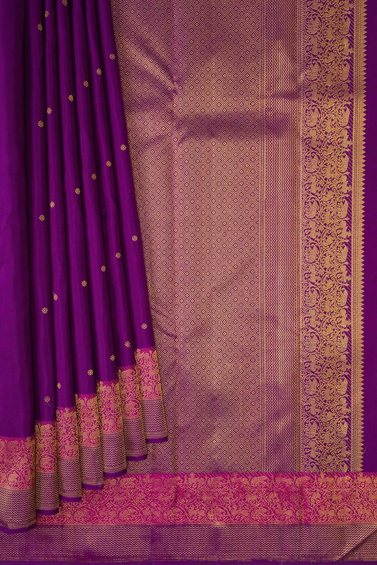 Pleats and pallu of Purple Kanjivaram Silk Saree with Zari Butta on the body and Fancy Border. 