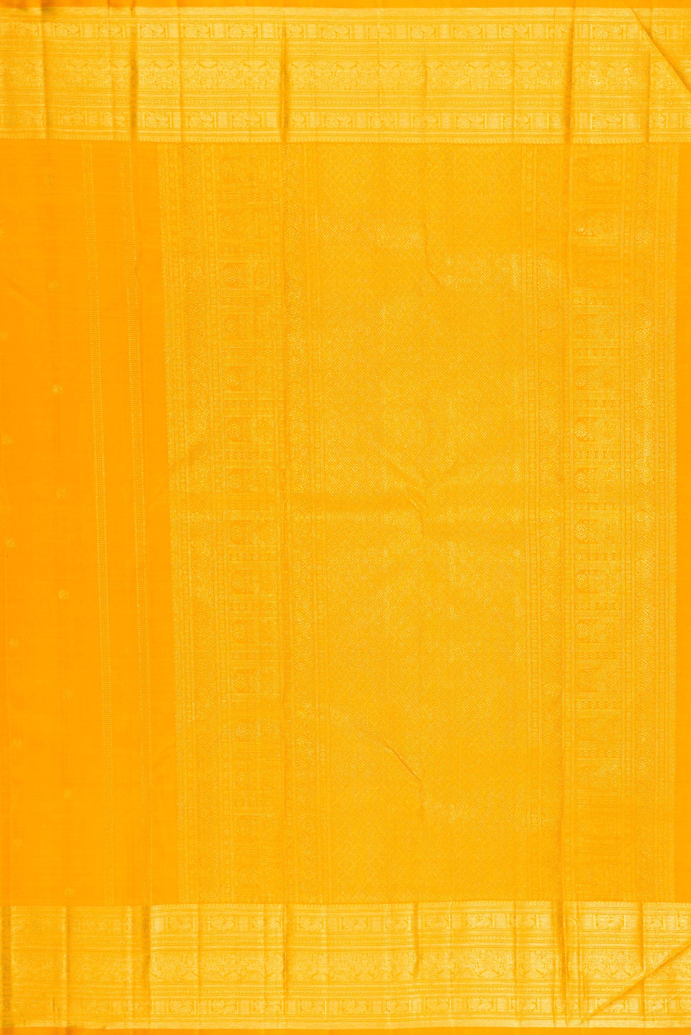 Close up image of the pallu of Yellow Kanjivaram Silk Saree with Zari Butta on the body and Zari Border. 