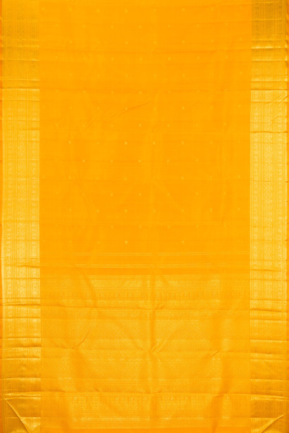 Flat view of Yellow Kanjivaram Silk Saree with Zari Butta on the body and Zari Border. 