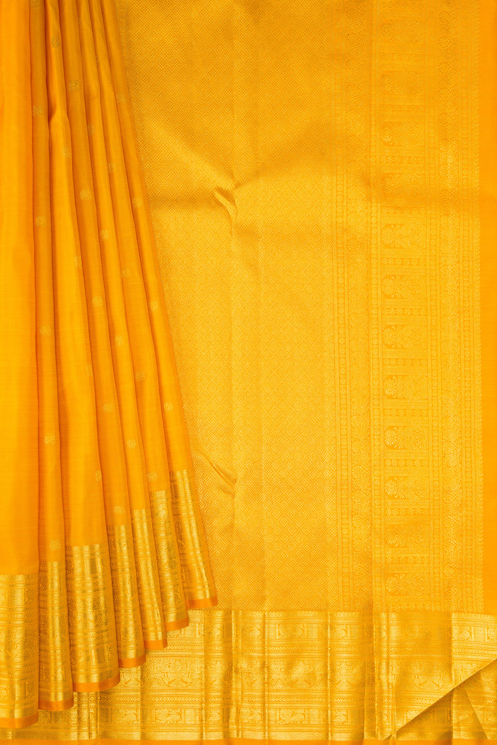 Pleats and pallu of Yellow Kanjivaram Silk Saree with Zari Butta on the body and Zari Border. 