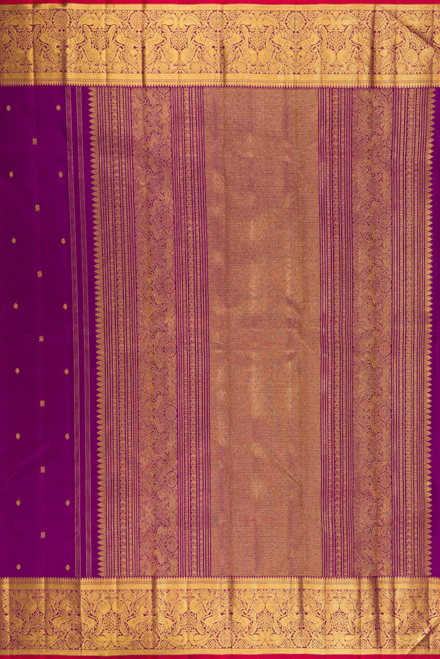 Close up image of the pallu of Purple Kanjivaram Silk Saree with Zari Butta on the body and Zari Border. 
