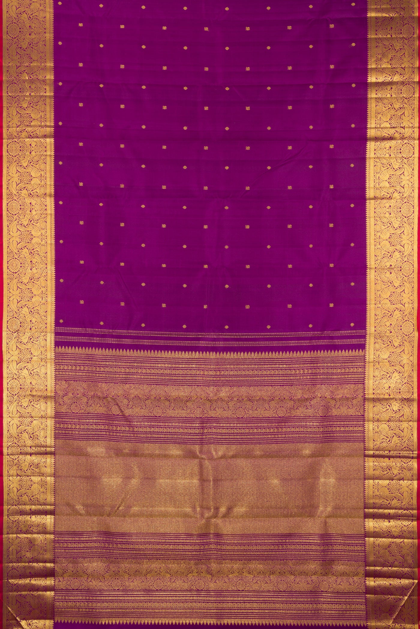 Flat view of Purple Kanjivaram Silk Saree with Zari Butta on the body and Zari Border. 