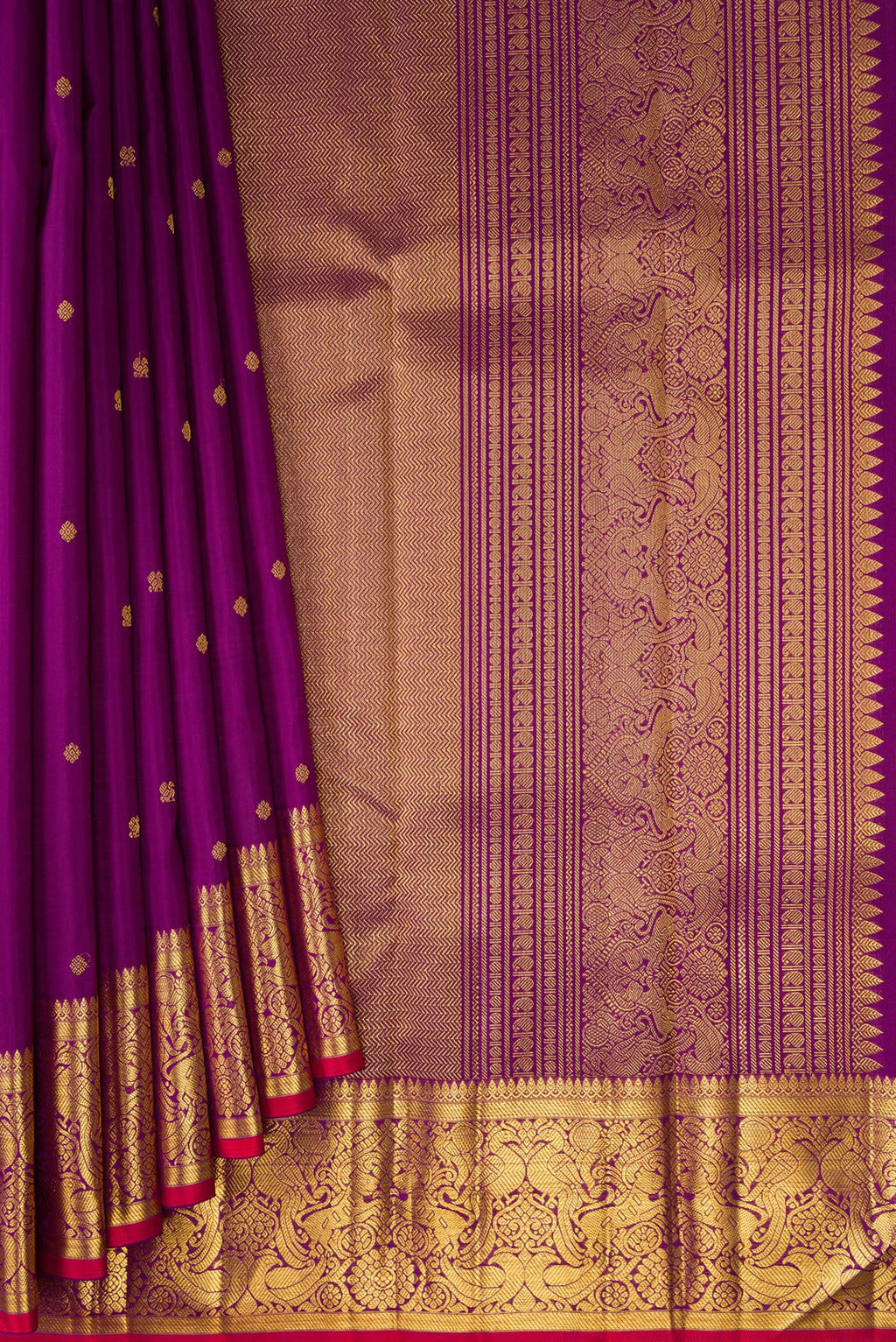 Pleats and pallu of Purple Kanjivaram Silk Saree with Zari Butta on the body and Zari Border. 