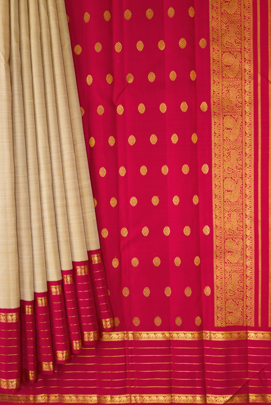 Pleats and pallu of Dark Beige Kanjivaram Silk Saree with Zari Butta on the body and Zari Border. 