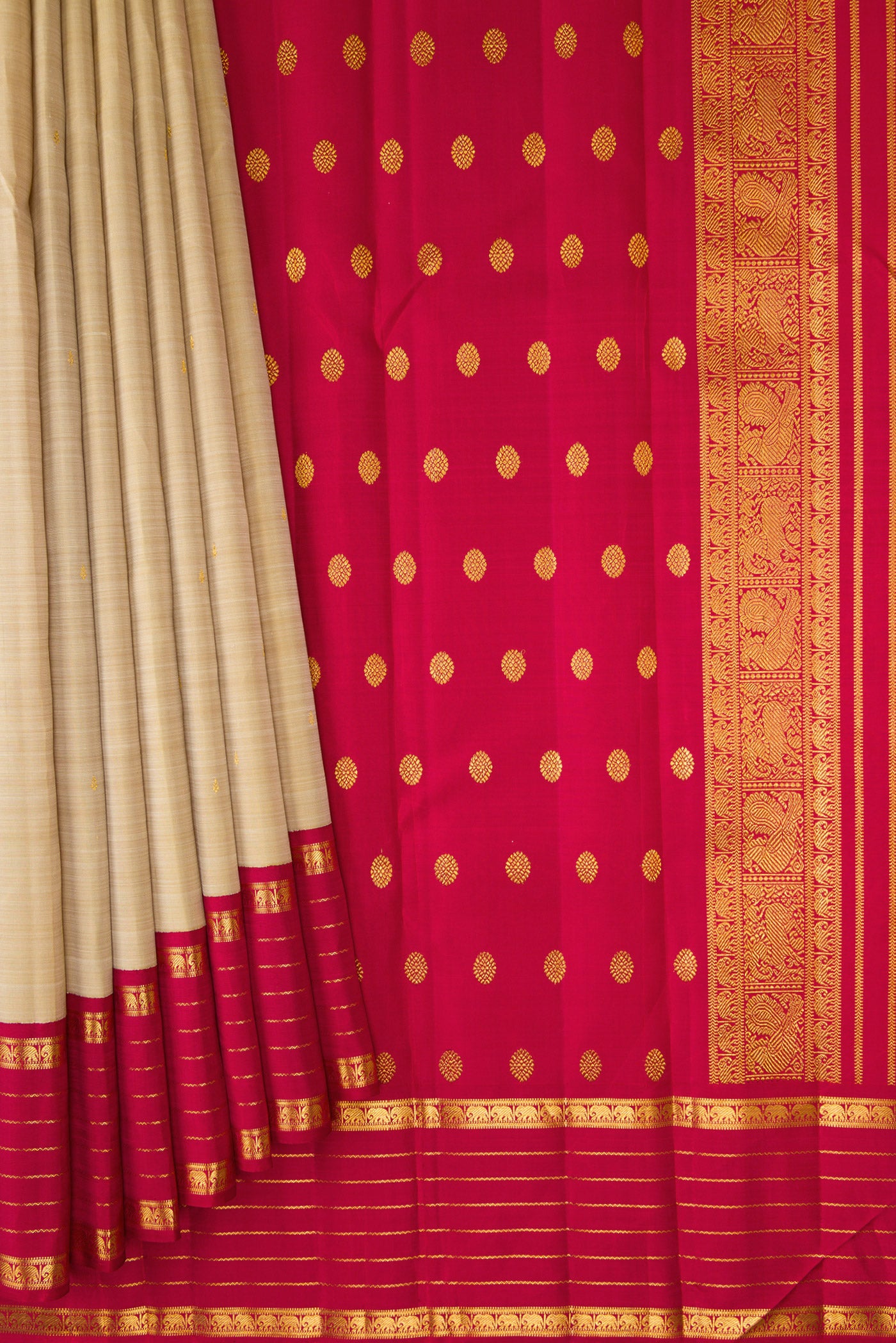 Pleats and pallu of Dark Beige Kanjivaram Silk Saree with Zari Butta on the body and Zari Border. 
