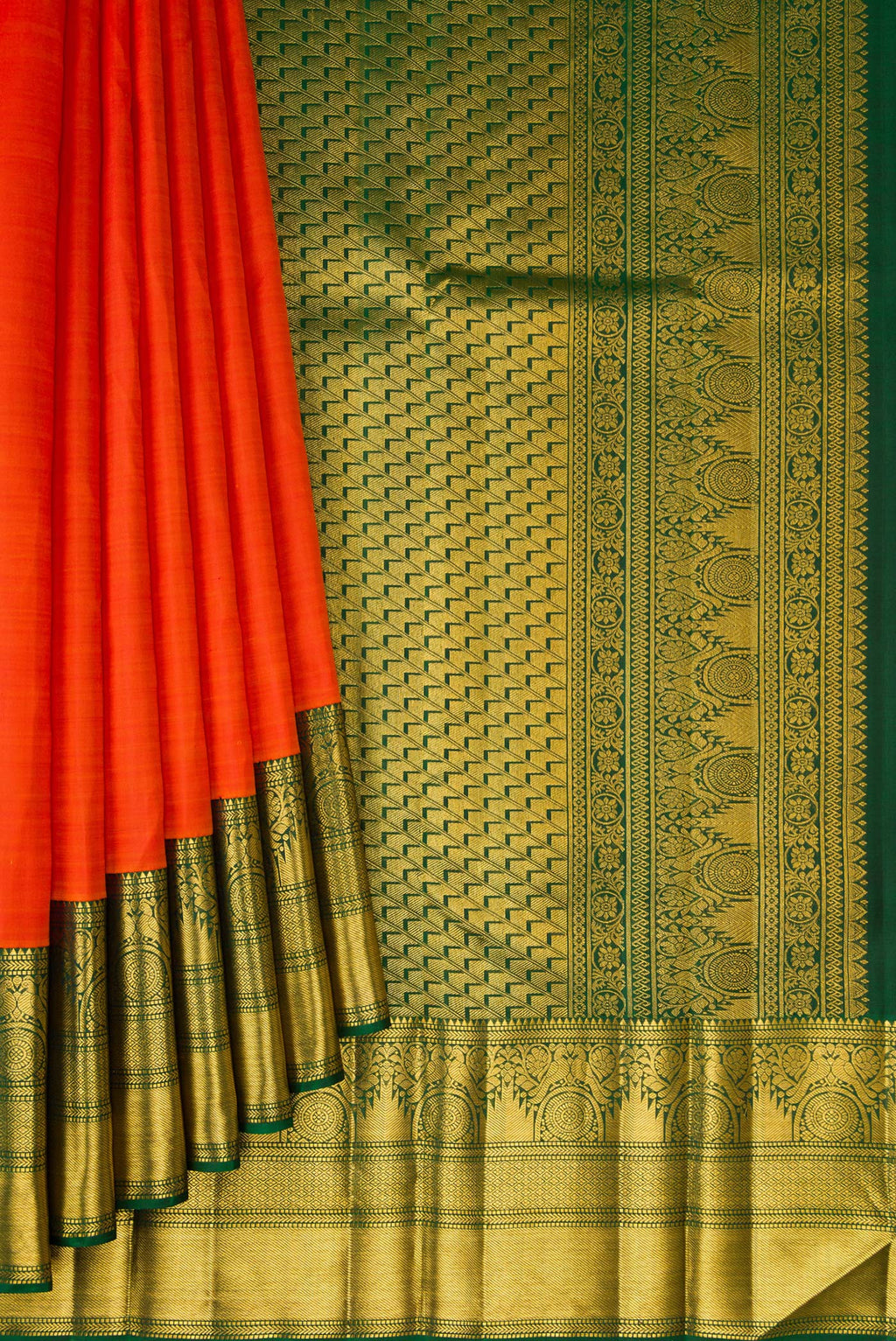 Pleats and pallu of Orange Kanchipuram Silk Saree with Plain Body and Fancy Border. 