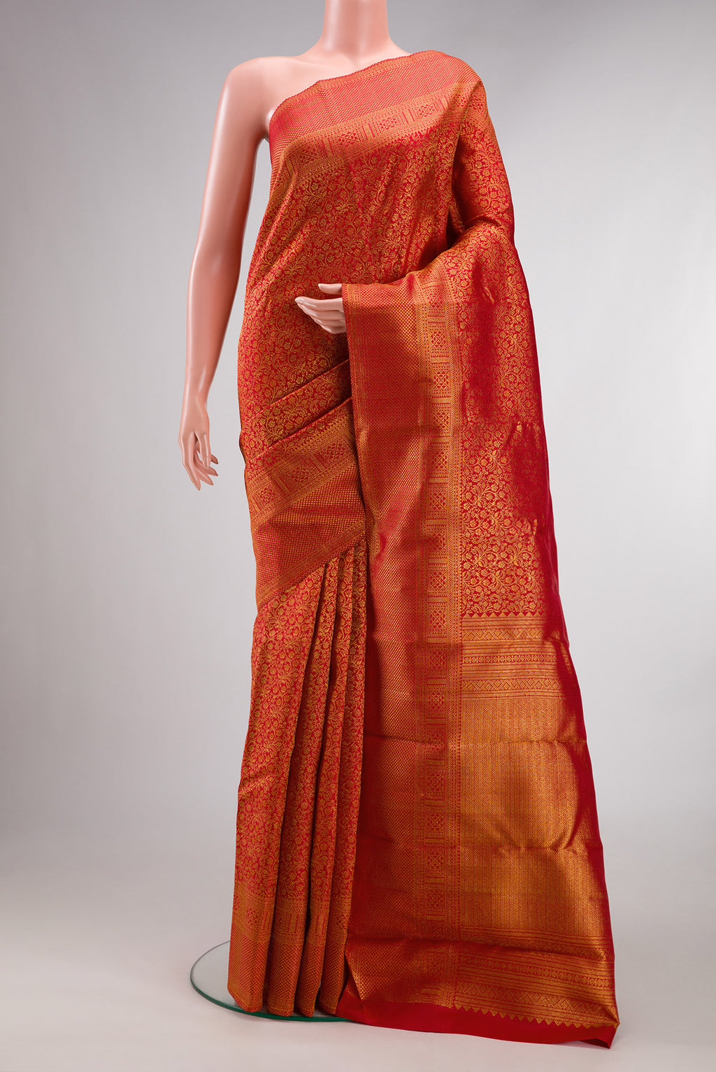 Pure Silk Red Dual Tone Kanchipuram Saree with Zari Brocade on the body and Fancy Border.  displayed on a mannequin