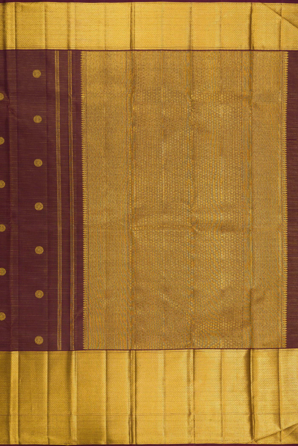 Close up image of the pallu of Brown Kanchipuram Silk Saree with Zari Butta on the body and Zari Border. 
