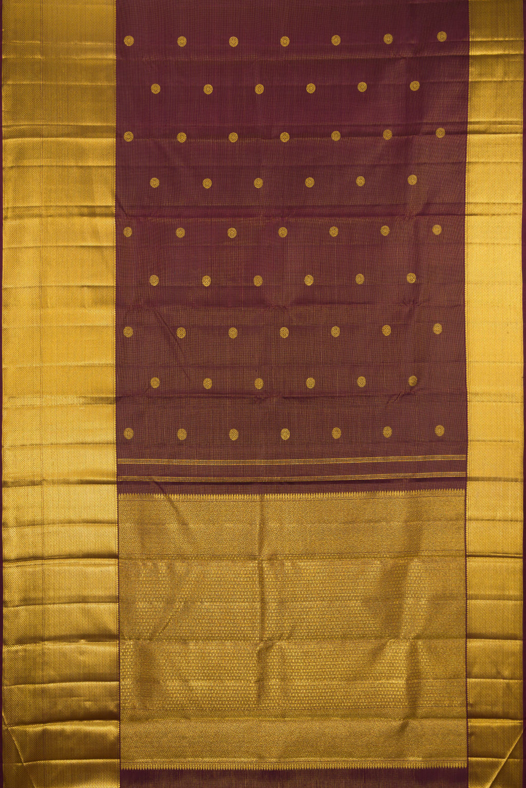 Flat view of Brown Kanchipuram Silk Saree with Zari Butta on the body and Zari Border. 