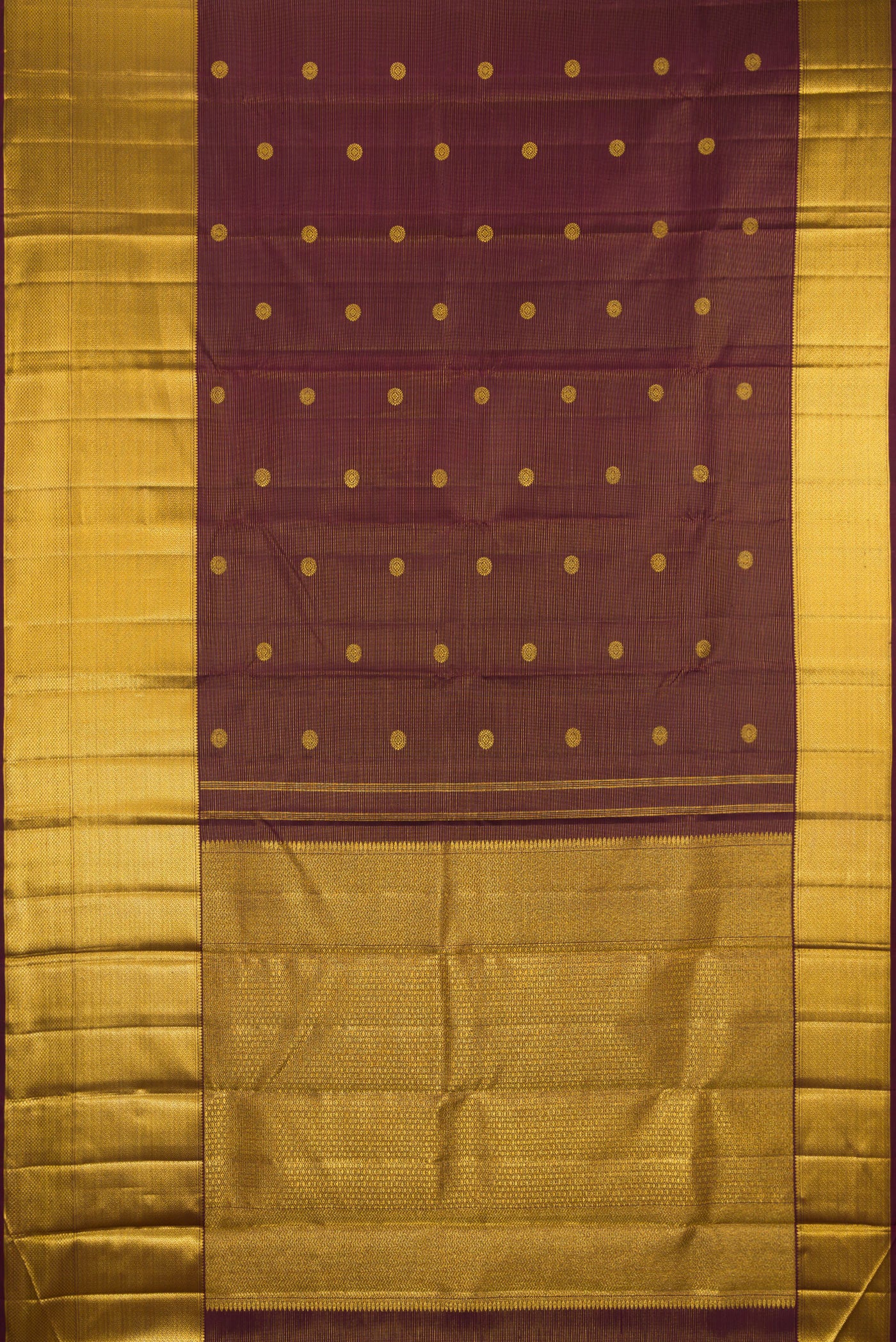 Flat view of Brown Kanchipuram Silk Saree with Zari Butta on the body and Zari Border. 