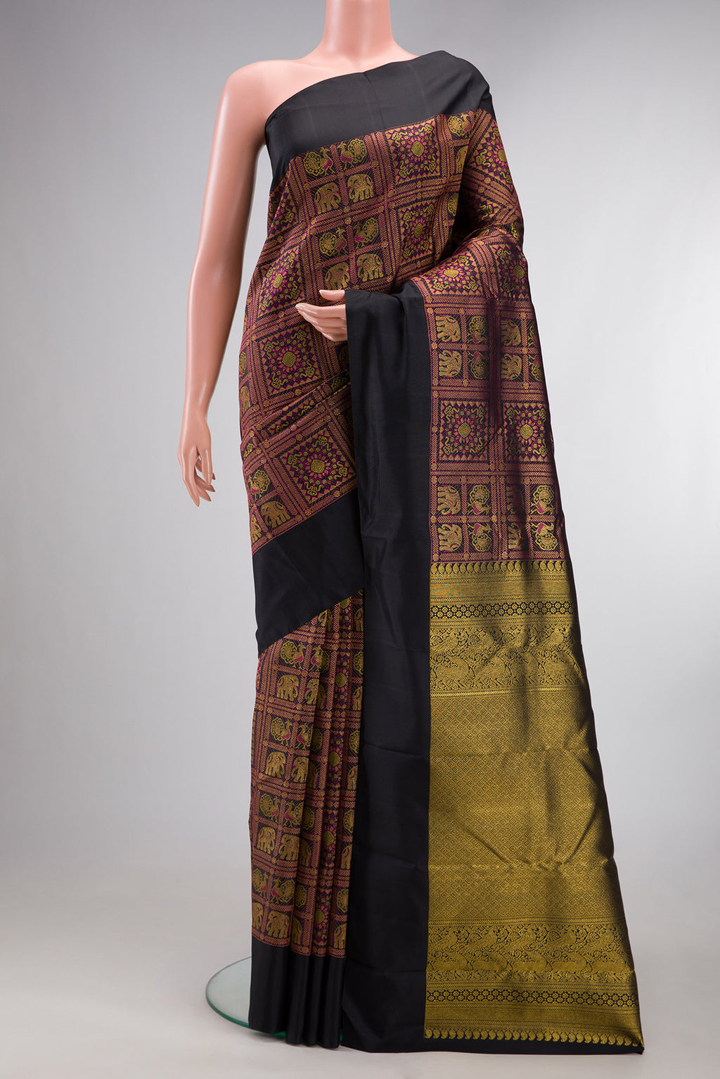 Pure Silk Black Kanchipuram Saree with Zari Brocade on the body and Plain Border.  displayed on a mannequin