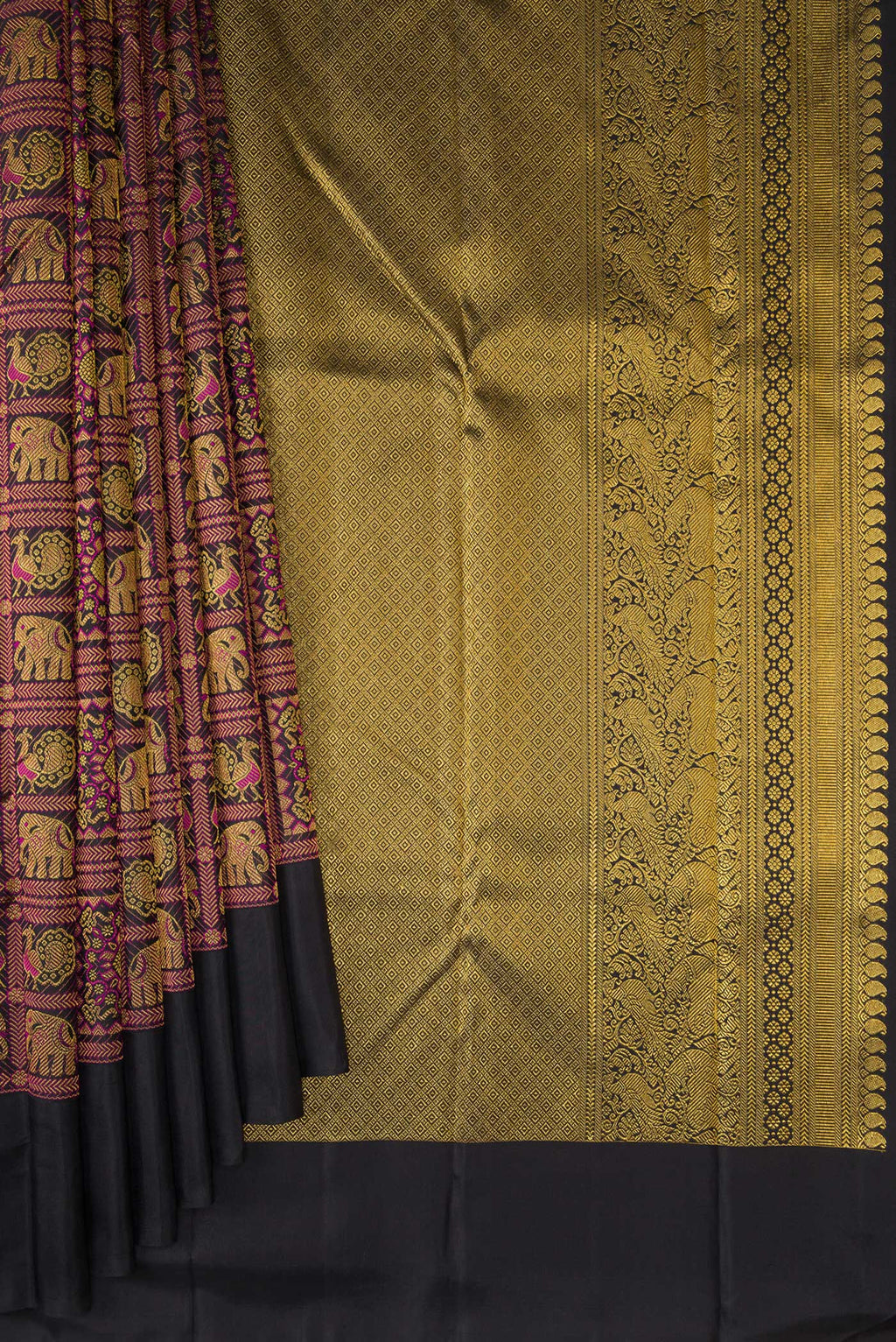 Pleats and pallu of Pure Silk Black Kanchipuram Saree with Zari Brocade on the body and Plain Border. 