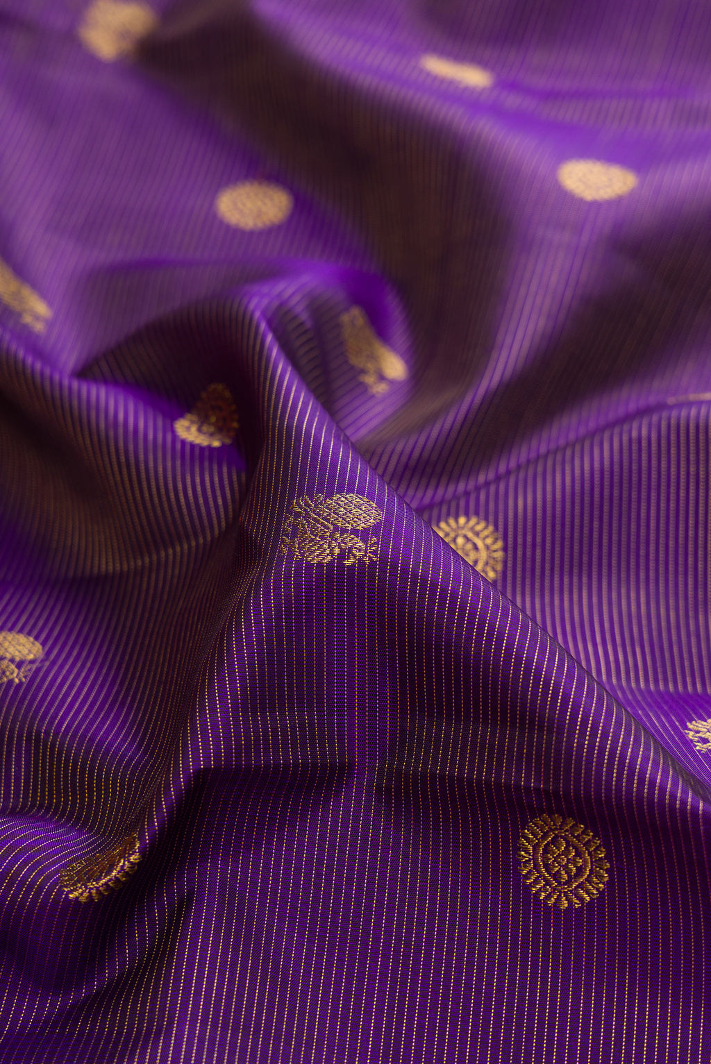 Close up of Navy Blue Dual Tone Kanchipuram Silk Saree with Stripes on the body and Fancy Border.  displaying folds