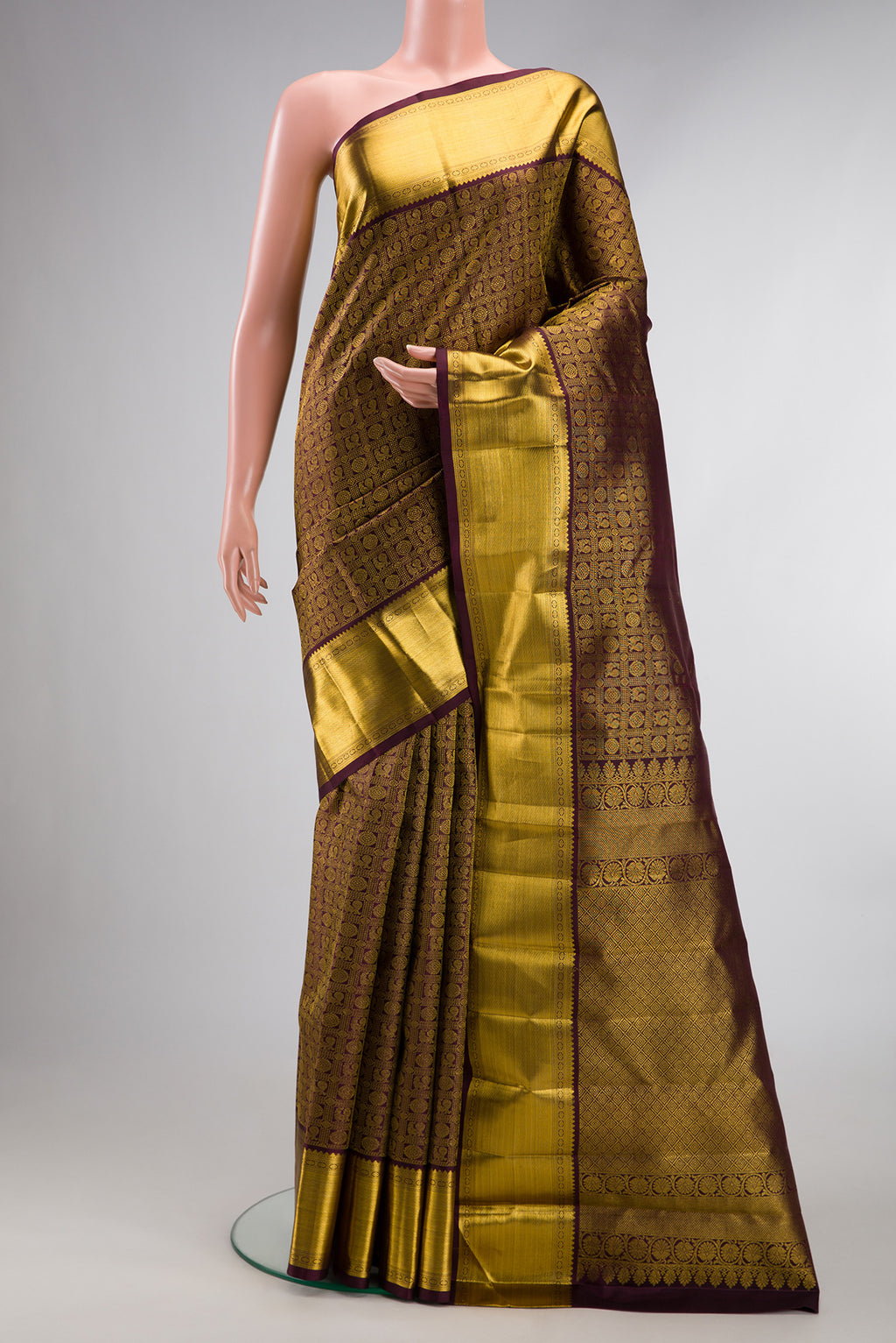 Pure Silk Coffee Brown Kanchipuram Saree with Zari Brocade on the body and Zari Border.  displayed on a mannequin