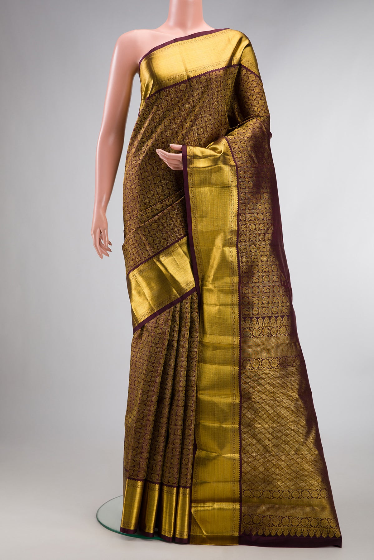 Pure Silk Coffee Brown Kanchipuram Saree with Zari Brocade on the body and Zari Border.  displayed on a mannequin