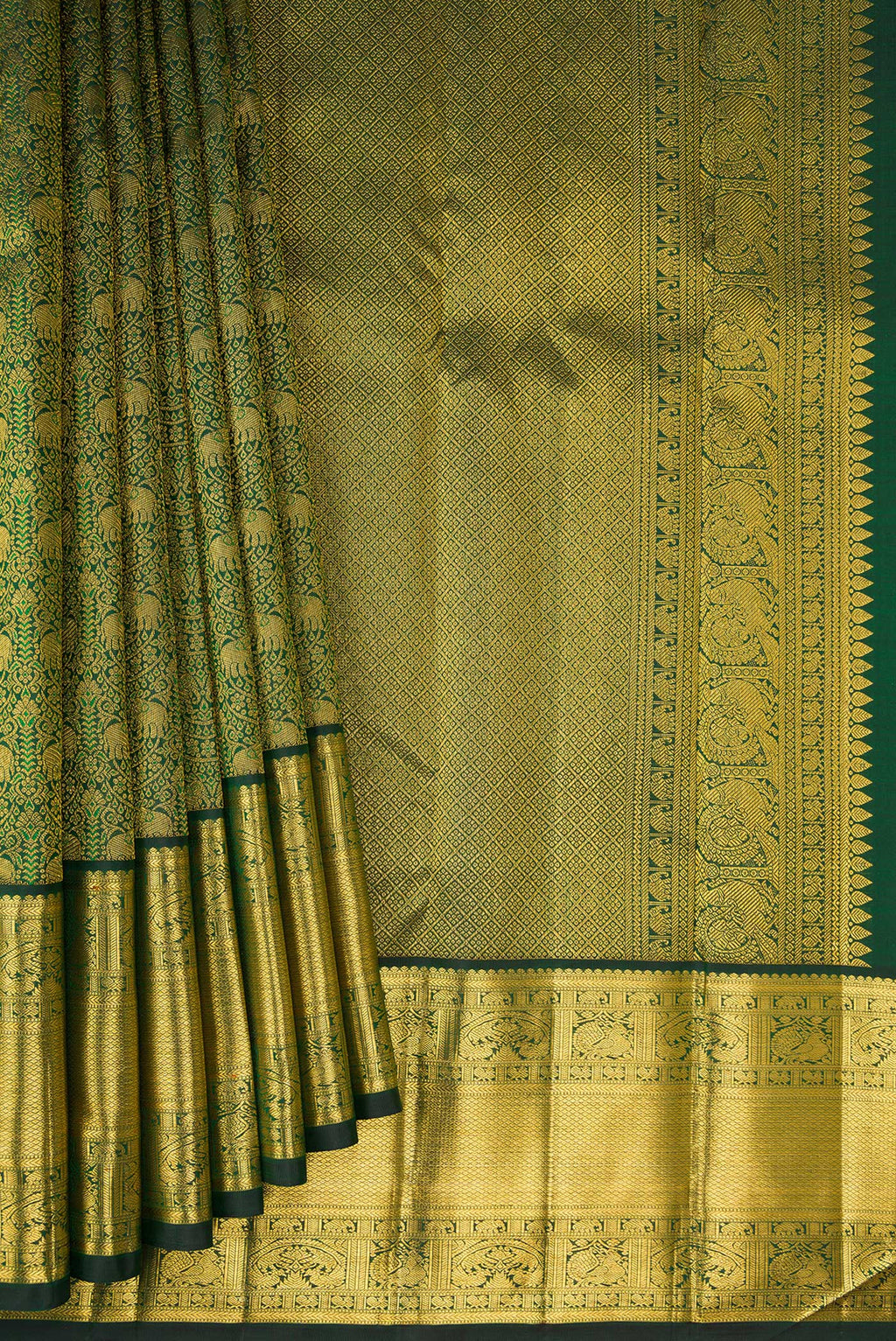Pleats and pallu of Pure Silk Bottle Green Kanchipuram Saree with Zari Brocade on the body and Zari Border. 