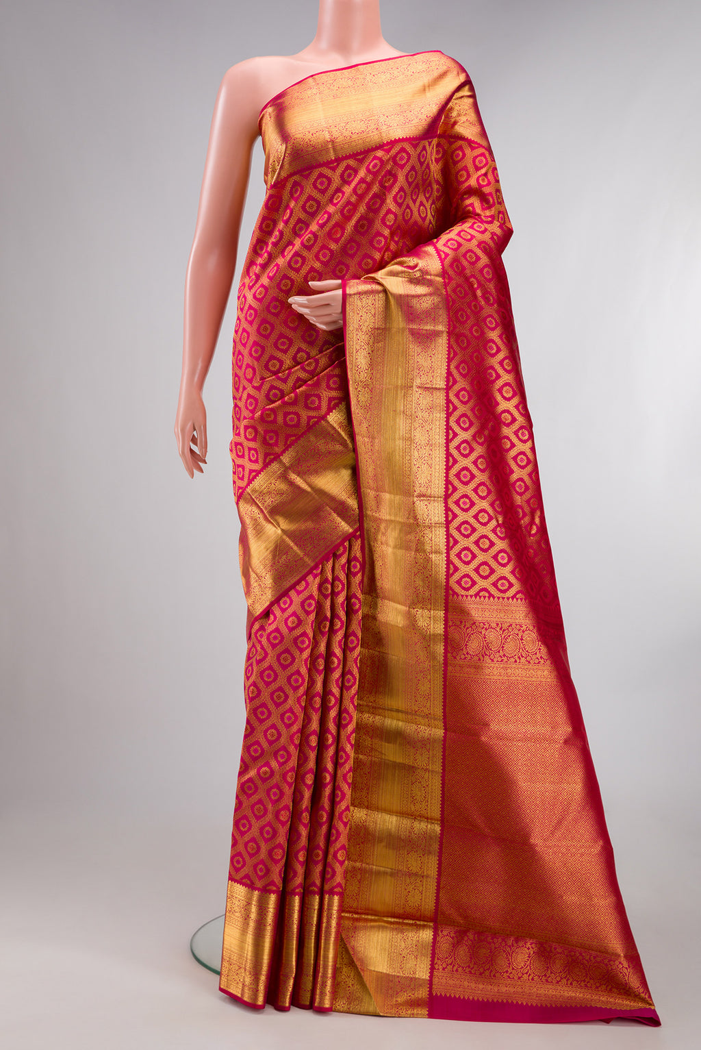 Pure Silk Dark Pink Dual Tone Kanchipuram Saree with Zari Brocade on the body and Zari Border.  displayed on a mannequin