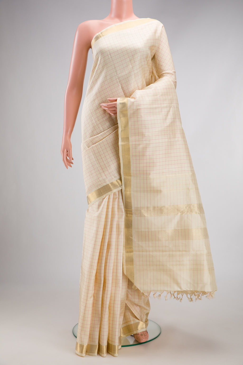 Beige Dual Tone Kanjivaram Silk Saree with Checked design on the body and Zari Border.  displayed on a mannequin
