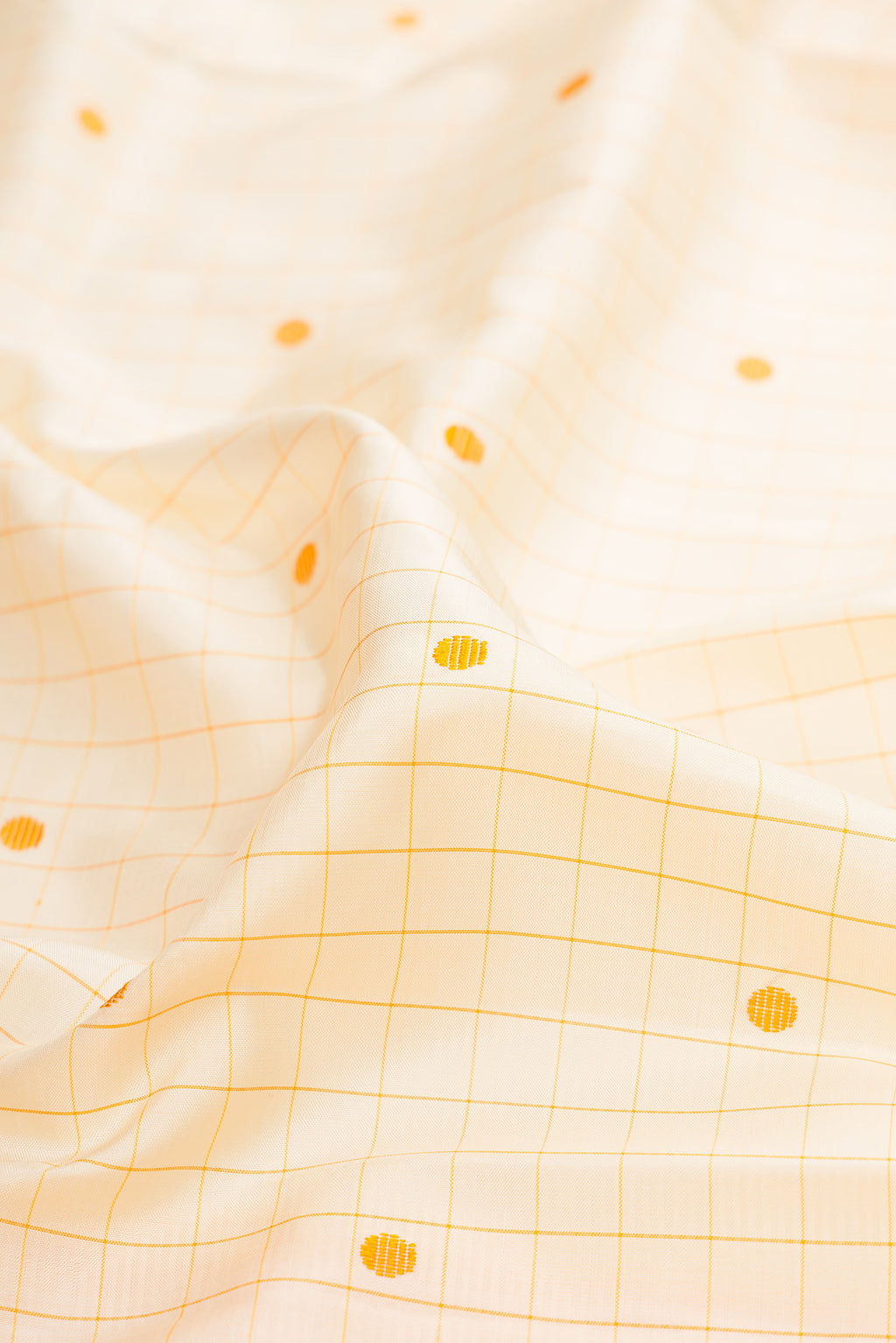 Close up of Sandal Kanjivaram Silk Saree with Checked design on the body and Thread Border.  displaying folds