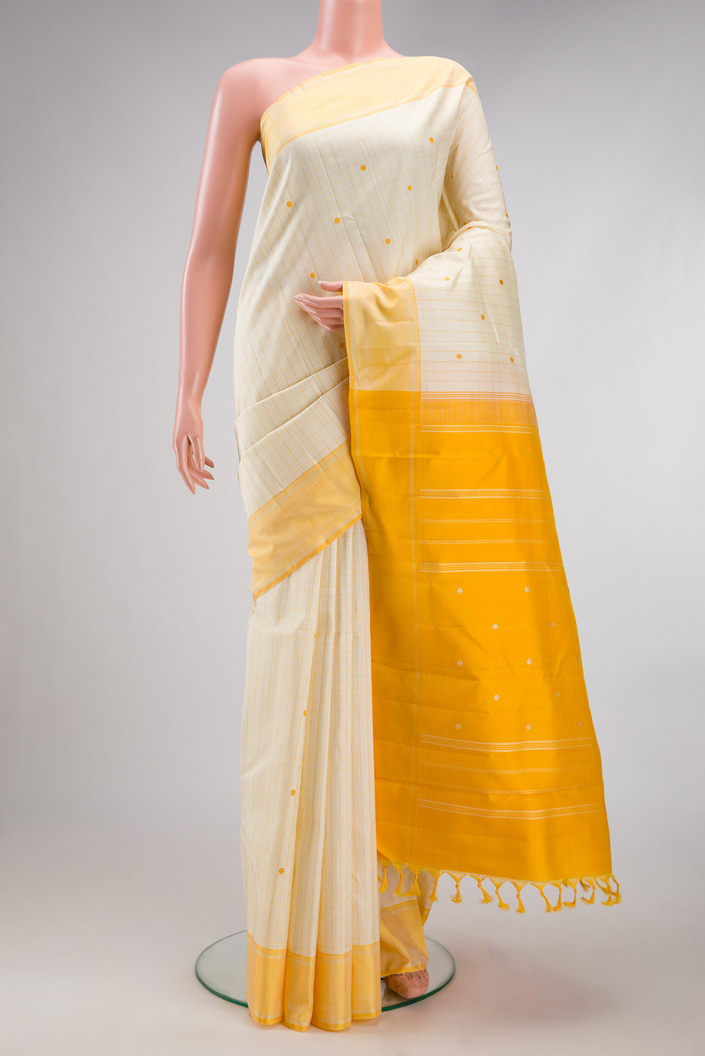 Sandal Kanjivaram Silk Saree with Checked design on the body and Thread Border.  displayed on a mannequin