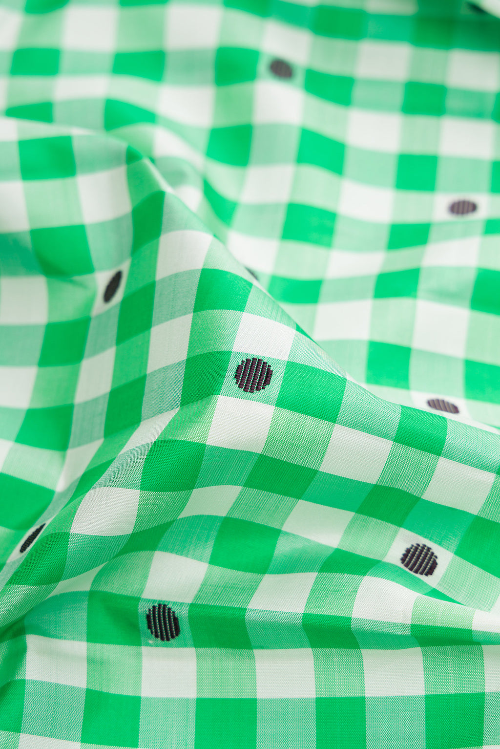 Close up of Multi Color Kanjivaram Silk Saree with Checked design on the body and Without Border.  displaying folds
