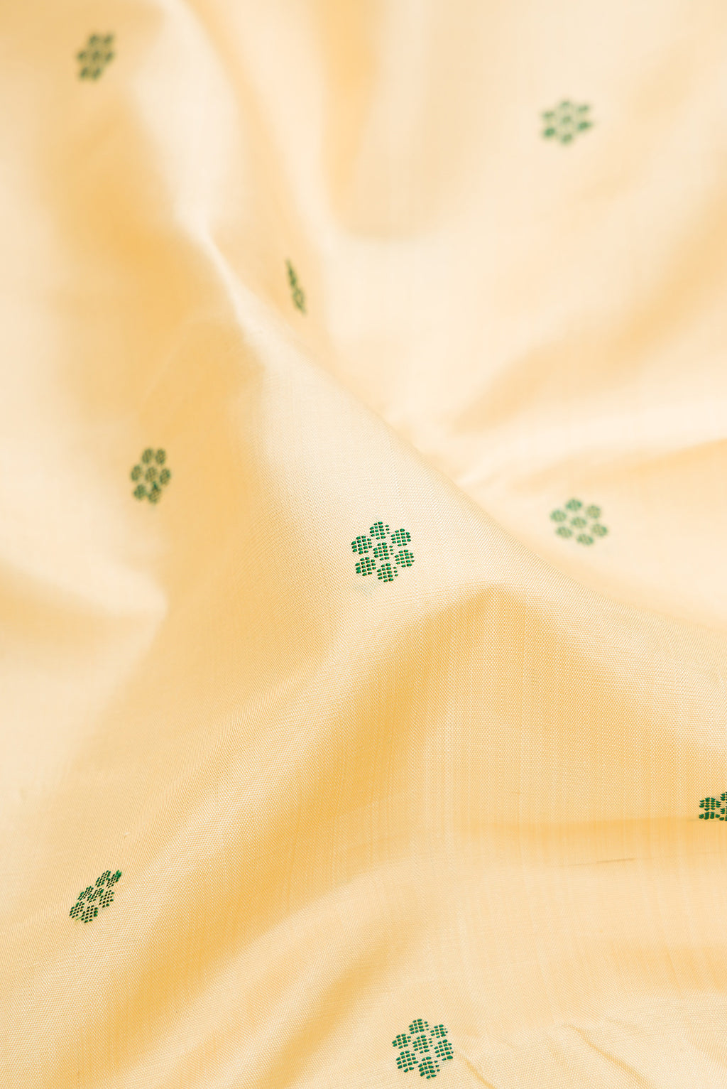 Close up of Pure Silk Pure Zari Sandal Dual Tone Kanjivaram Saree with Thread Butta on the body and Zari Border.  displaying folds