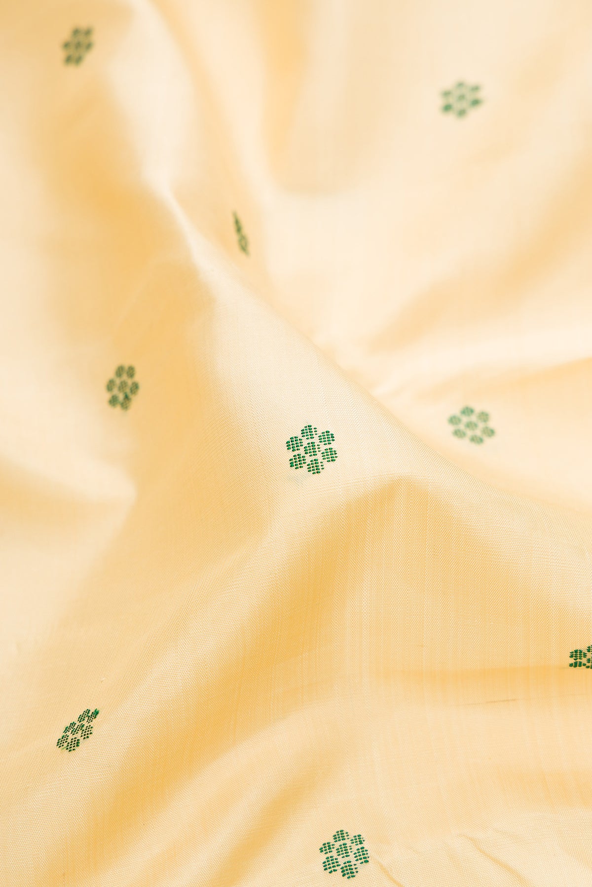 Close up of Pure Silk Pure Zari Sandal Dual Tone Kanjivaram Saree with Thread Butta on the body and Zari Border.  displaying folds