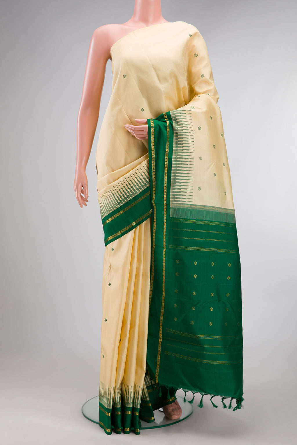 Pure Silk Pure Zari Sandal Dual Tone Kanjivaram Saree with Thread Butta on the body and Zari Border.  displayed on a mannequin