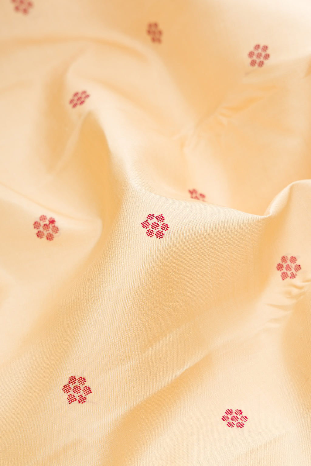 Close up of Pure Silk Pure Zari Sandal Kanjivaram Saree with Thread Butta on the body and Plain Border.  displaying folds