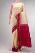 Pure Silk Pure Zari Sandal Kanjivaram Saree with Thread Butta on the body and Plain Border.  displayed on a mannequin