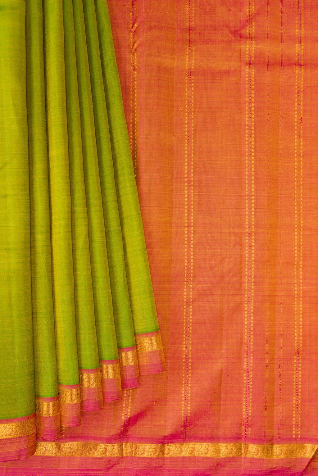 Pleats and pallu of Parrot Green Kanjivaram Silk Saree with Plain Body and Zari Border. 