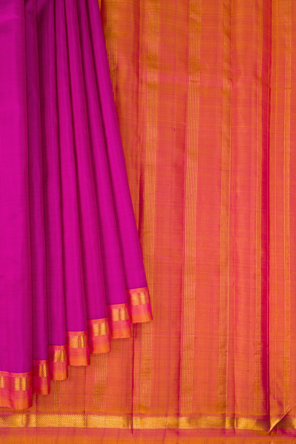 Pleats and pallu of Magenta Kanjivaram Silk Saree with Plain Body and Zari Border. 