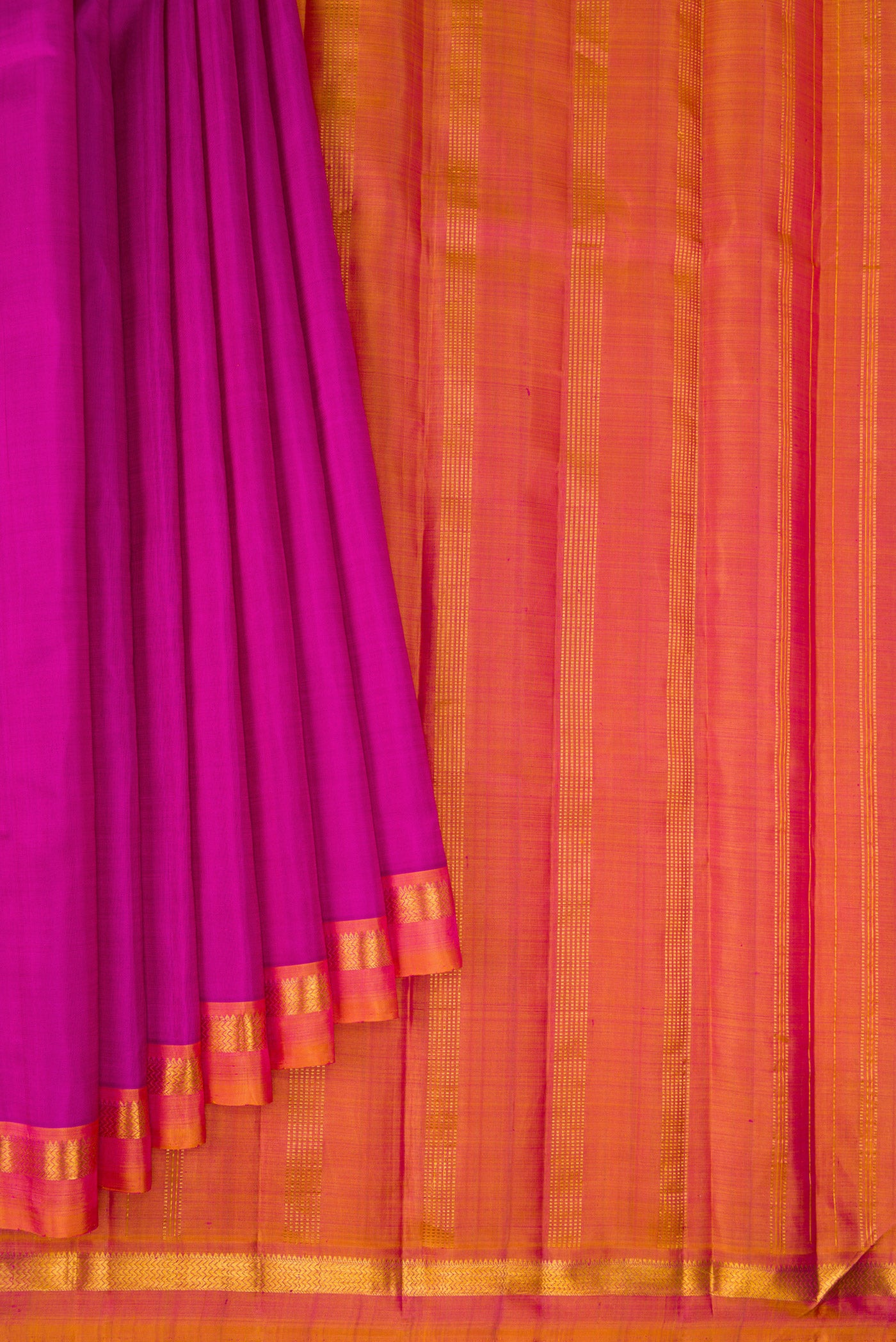Pleats and pallu of Magenta Kanjivaram Silk Saree with Plain Body and Zari Border. 