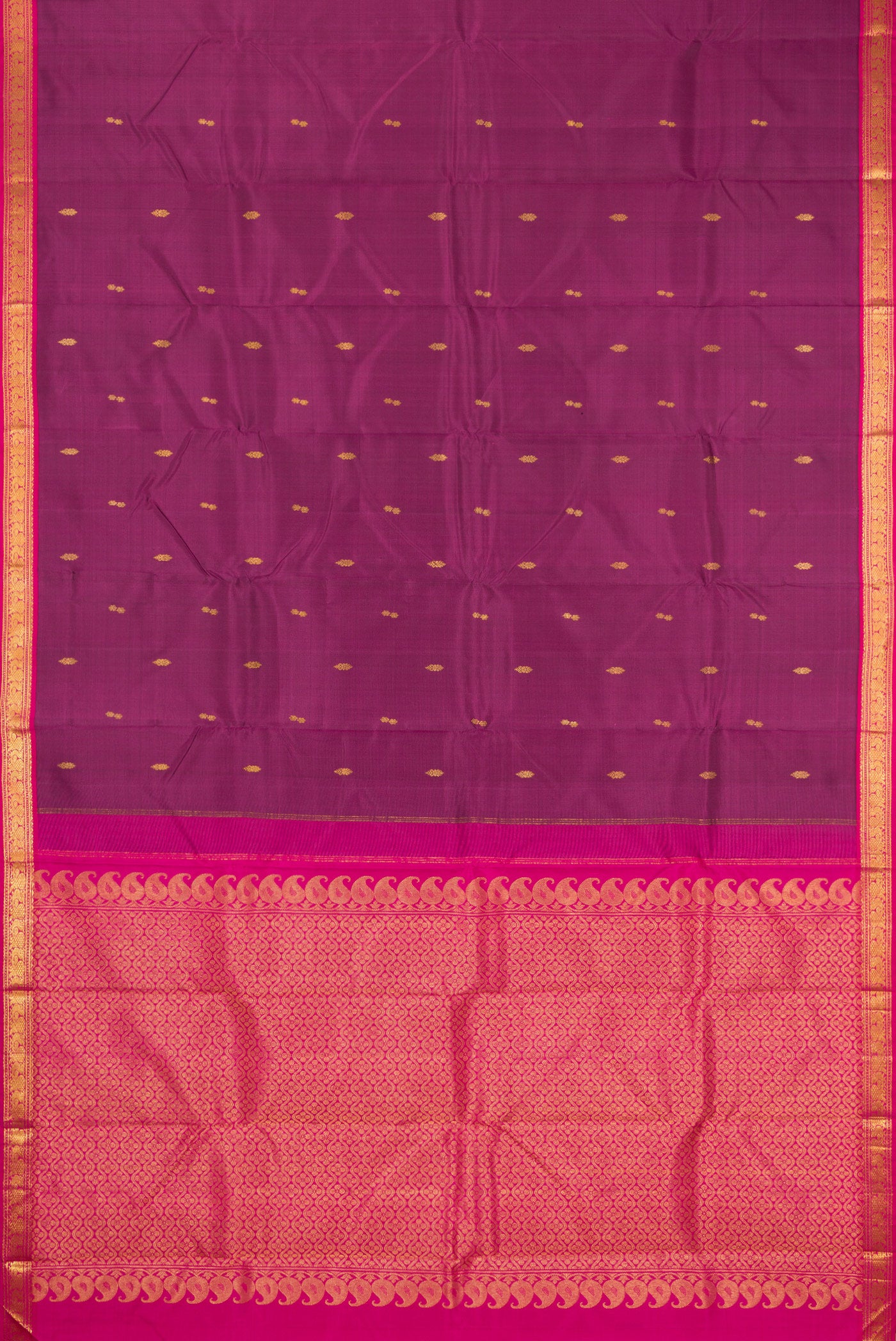 Flat view of Magenta Kanchipuram Silk Saree with Zari Butta on the body and Zari Border. 